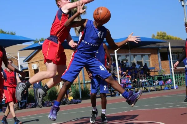 basketball player blocking shot